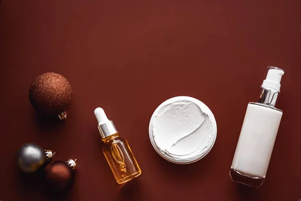 Beauty products and Christmas, luxury skincare, spa and cosmetic hair or body care product flat lay on chocolate background, wellness cosmetics as holiday gift, online shopping delivery, flatlay.