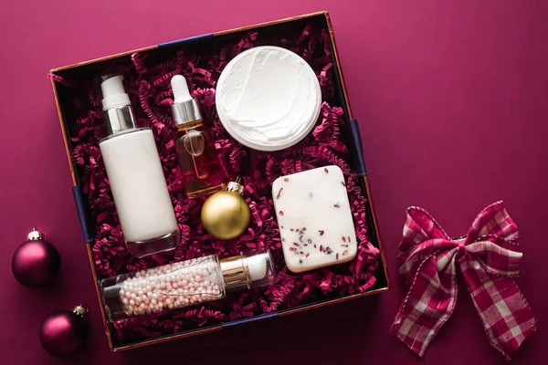 Christmas gift set, xmas holidays beauty box subscription package and luxury skincare products flatlay, cosmetic flat lay on pink background, cosmetics as holiday present or shopping delivery, top