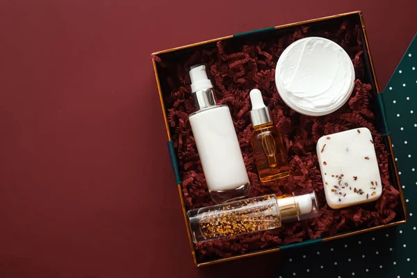 Beauty box subscription package and luxury skincare products, cosmetic body care product flat lay on mahogany background, wellness cosmetics as holiday gift, online shopping delivery, flatlay view