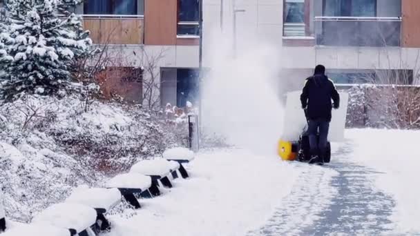 Snowing Weather Conditions Unrecognisable Man Using Snow Removal Machine Clean — Vídeos de Stock