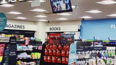 Luton, Bedfordshire, England, United Kingdom circa January 2023: Duty Free stores and coffee shops at London Luton Airport