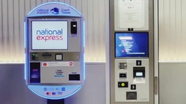 Luton, Bedfordshire, England, United Kingdom circa January 2023: Cash machine, bank ATM and currency exchange at London Luton Airport