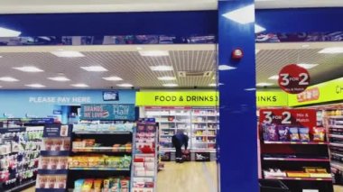 Luton, Bedfordshire, England, United Kingdom circa January 2023: Duty Free stores and coffee shops at London Luton Airport