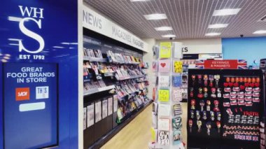 Luton, Bedfordshire, England, United Kingdom circa January 2023: Duty Free stores and coffee shops at London Luton Airport