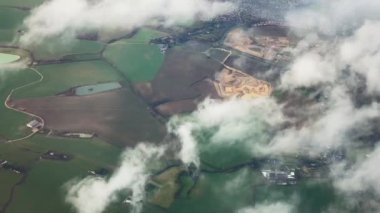 Aerial view of the English countryside landscape, rural nature and towns in England, United Kingdom.