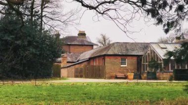 Cottage farm house in autumn or winter, cold season in England, United Kingdom, farmland and nature of the English countryside.