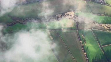 Aerial view of the English countryside landscape, rural nature and towns in England, United Kingdom.