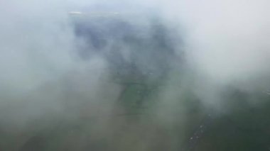 Aerial view of rolling hills of the English countryside landscape, beautiful nature, rural fields and green pastures on a sunny day in England, United Kingdom.