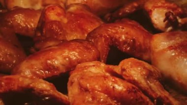 Chicken wings being roasted in the oven.