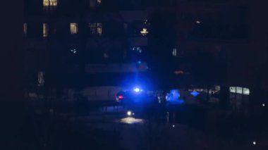Police car at night in the residential area.