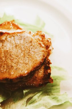 Food and diet, fried pork fillet with lettuce as meal for lunch or dinner, tasty recipe idea