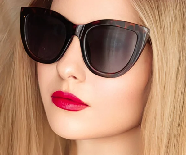 stock image Beauty, fashion and style, face portrait of beautiful woman wearing stylish cat eye sunglasses and red lipstick make-up, luxury accessory and summer lifestyle, glamour and chic look.