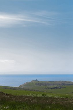 Belle Tout Lighthouse on the English Channel coast, providing guidance and safety to ships. East Sussex countryside, England