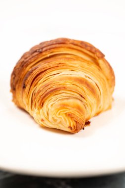 Golden crunchy fresh baked croissant using 75 percent butter weight and the method of 3 single folds.