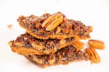 Golden crunchy fresh baked pecan diamond cookies made on a rich short dough.