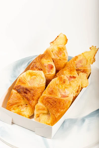 Flakey and buttery golden brown ham and cheese croissants