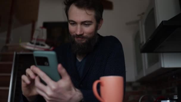 Happy Man Drinking Cup Coffee Home Young Man Using Smartphone — Stock Video