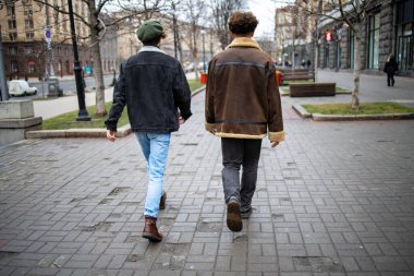 Young people walk along the street in Kyiv of Ukraine.