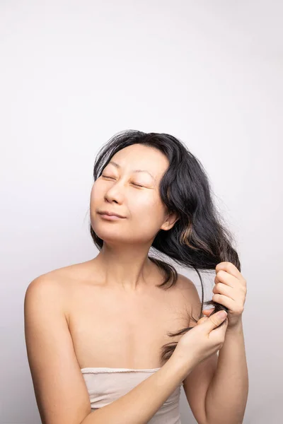 Asian woman have damaged and broken hair, loss hair, dry problem concept.