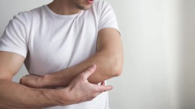 Man with elbow pain, Pain relief concept. Human pain concept.