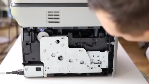 Printer Repair Technician Male Handyman Inspects Printer Starting Repairs Client — Video