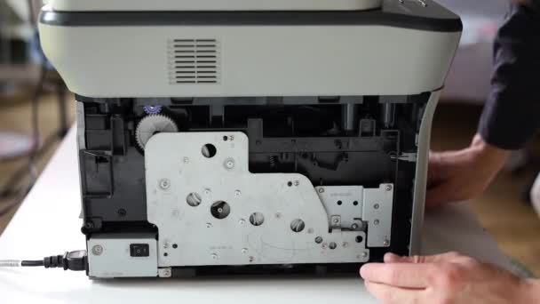 Printer Repair Technician Male Handyman Inspects Printer Starting Repairs Client — Video