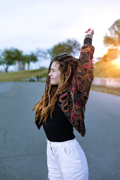 stock image Portrait of a stylish teenage girl with dreadlocks on city street.