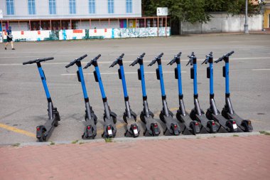 Electric scooters for public share standing outside in european city center public mobile transport