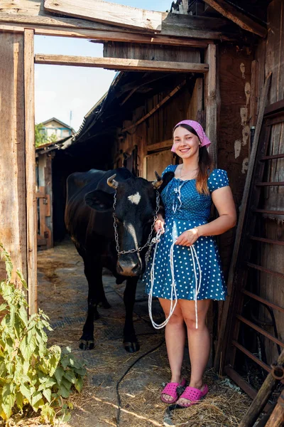 Portrait of woman farmer smiling in the cow farm