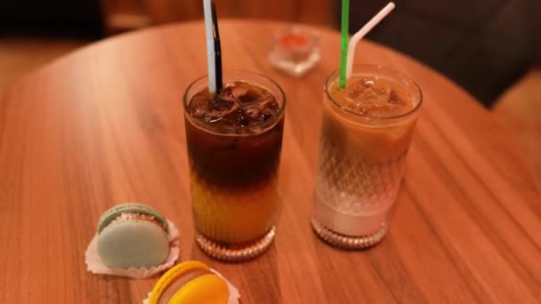 Two Macaroons Iced Black Coffee Orange Juice Cafe Small Business — Vídeo de Stock