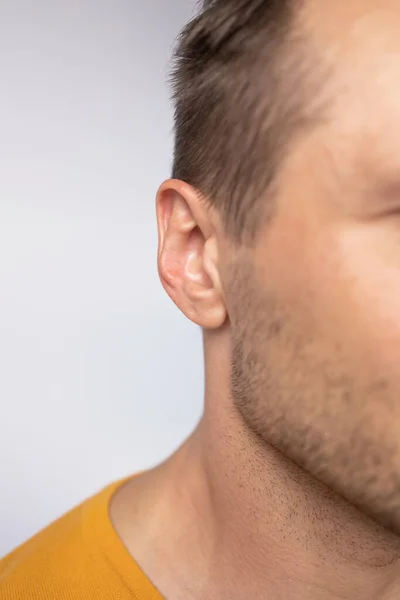 Close-up shot of a human ear or ear doctor examination