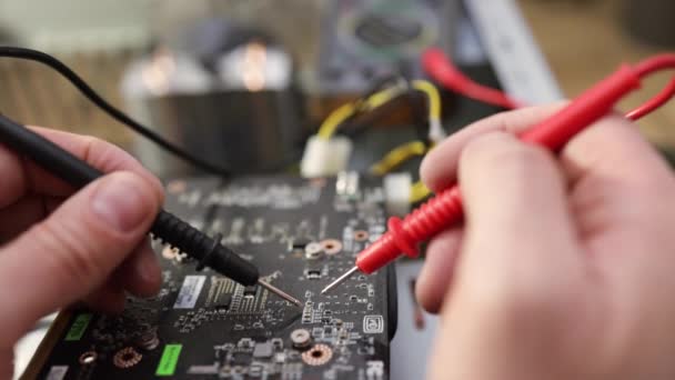 Close Image Technician Man Hand Measuring Electrical Voltage Computer Mainboard — Stock Video