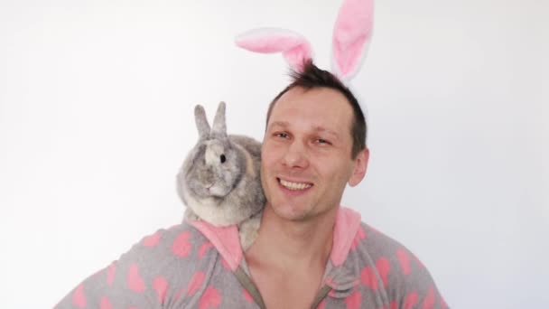 Portrait Smiling Handsome Man Holding Fluffy Easter Rabbit Wearing Bunny — Stock video