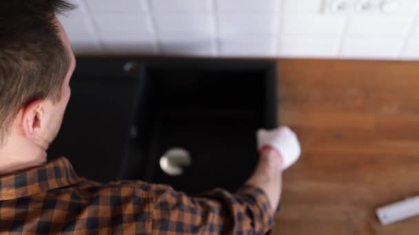 Man Installs Sink Kitchen Assembly Kitchen Furniture — Stock Video
