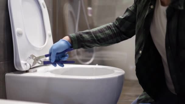 Plumber Handyman Fixing Toilet Bathroom Tradesman Using His Tools Repair — Stock Video