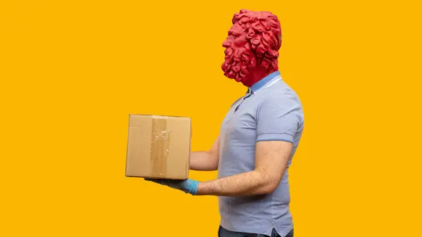 stock image Abstract modern collage. The man with the plaster head of David holding cardboard boxes in medical rubber gloves. Delivery concept