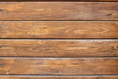 Kahverengi ahşap yapısı doğal ağaçtan geliyor. Tahta panelin güzel koyu bir deseni var, ahşap döşeme dokusu.