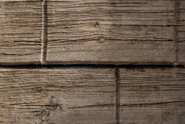 Kahverengi ahşap yapısı doğal ağaçtan geliyor. Tahta panelin güzel koyu bir deseni var, ahşap döşeme dokusu.