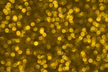 Soyut Noel ışıkları arka planda parıldıyor. Noel altın desenli arka plan.