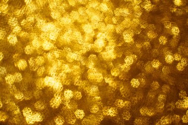 Noel arkaplanı. Bokeh odaklı ışıklar ve yıldızlarla şenlikli soyut arkaplan.