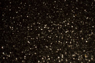 Noel arkaplanı. Bokeh odaklı ışıklar ve yıldızlarla şenlikli soyut arkaplan.