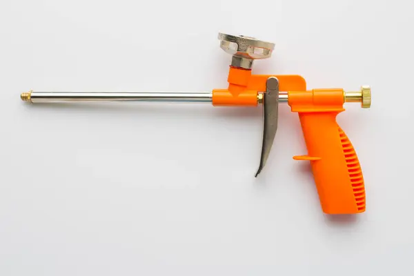 stock image mounting foam sprayer gun pistol tool on white background.