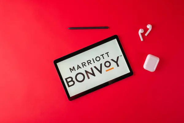 stock image Tula, Russia - october 19, 2021: Marriott International Bonvoy displayed modern laptop on red background