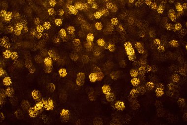 Noel arkaplanı. Bokeh odaklı ışıklar ve yıldızlarla şenlikli soyut arkaplan.