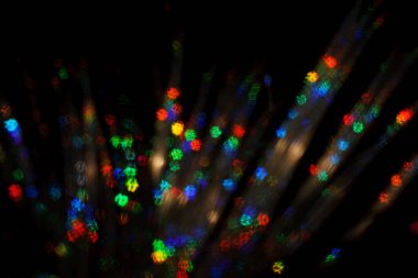 Noel arkaplanı. Bokeh odaklı ışıklar ve yıldızlarla şenlikli soyut arkaplan.