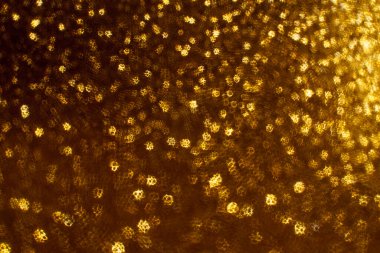 Noel arkaplanı. Bokeh odaklı ışıklar ve yıldızlarla şenlikli soyut arkaplan.