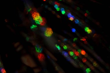 Noel arkaplanı. Bokeh odaklı ışıklar ve yıldızlarla şenlikli soyut arkaplan.