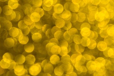 Soyut Noel ışıkları arka planda parıldıyor. Noel altın desenli arka plan.