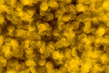 Soyut Noel ışıkları arka planda parıldıyor. Noel altın desenli arka plan.