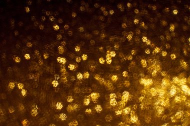 Noel arkaplanı. Bokeh odaklı ışıklar ve yıldızlarla şenlikli soyut arkaplan.